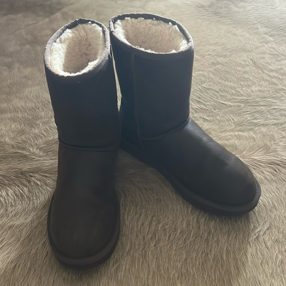 Women’s UGG boots with leather like water resistant exterior